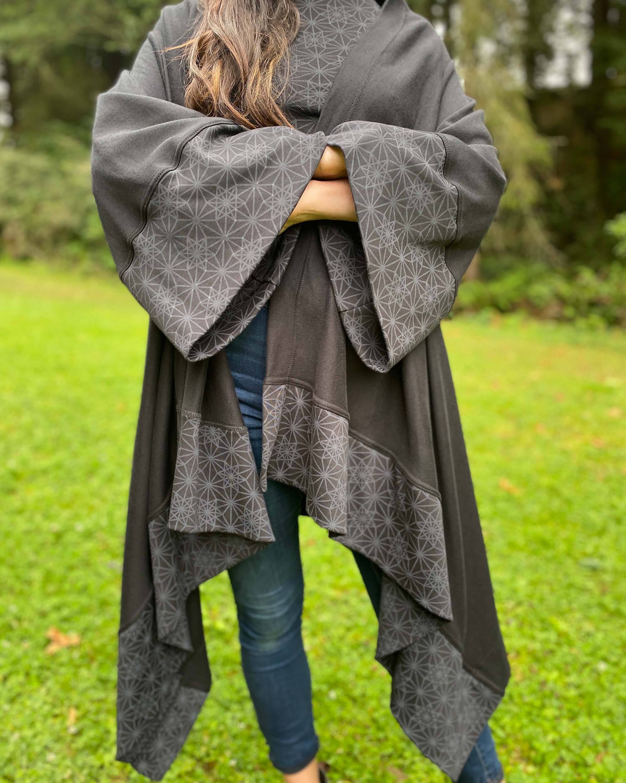 Organic cotton kimono, black with geo print accents, detail view of sleeve fabrics.