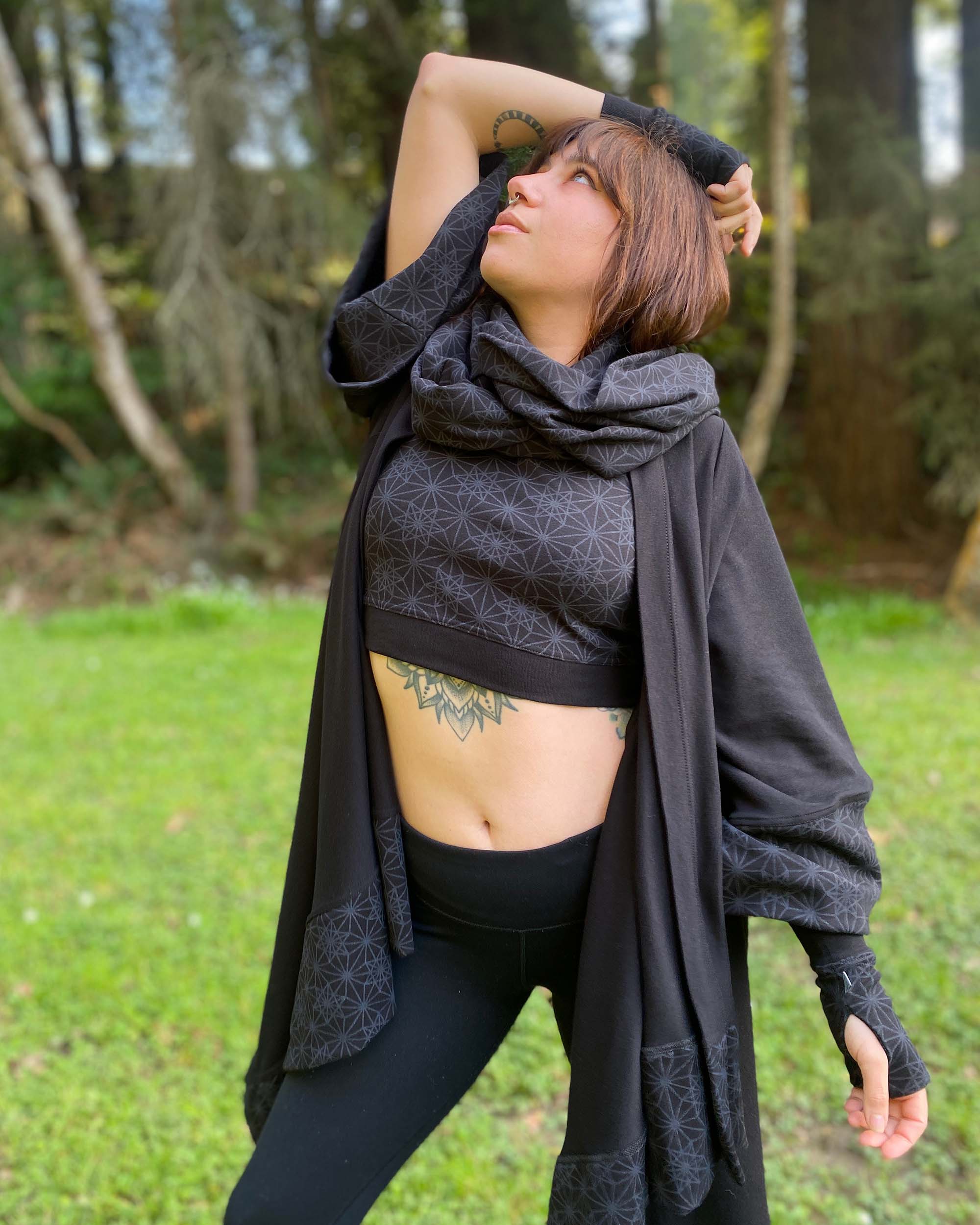 Organic cotton kimono, black with geo print fabric, front right side view on female model.