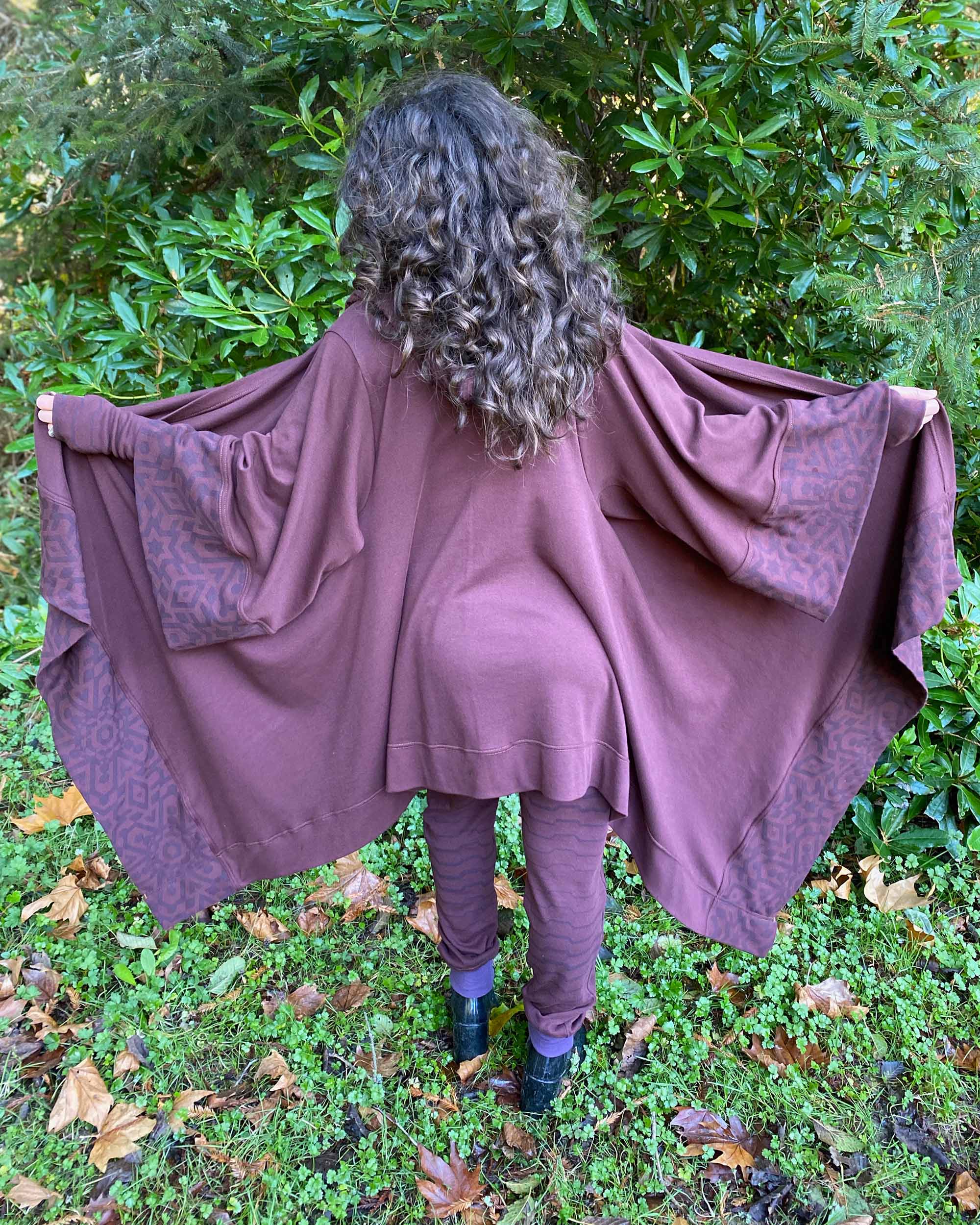 Organic cotton kimono, brown with geo fabric accents, back view on female model.
