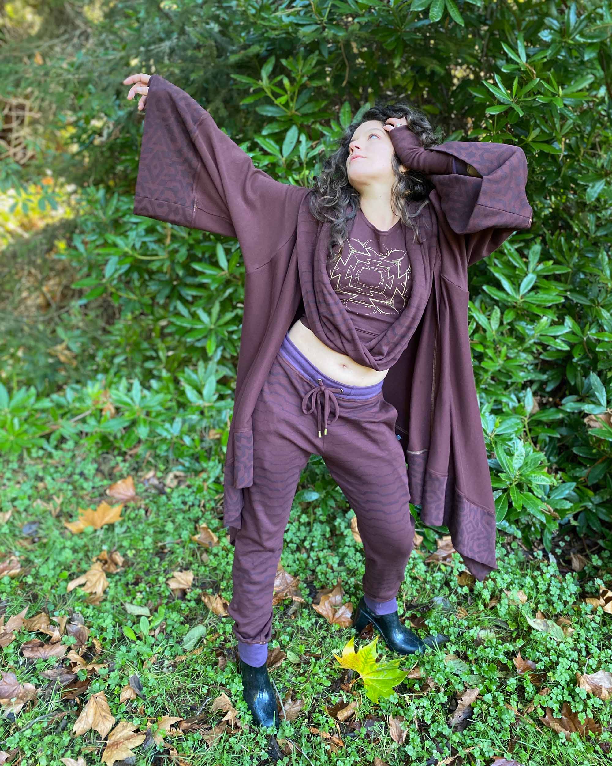 Organic cotton kimono, reddish brown with geometric fabric accents, front view on female model.
