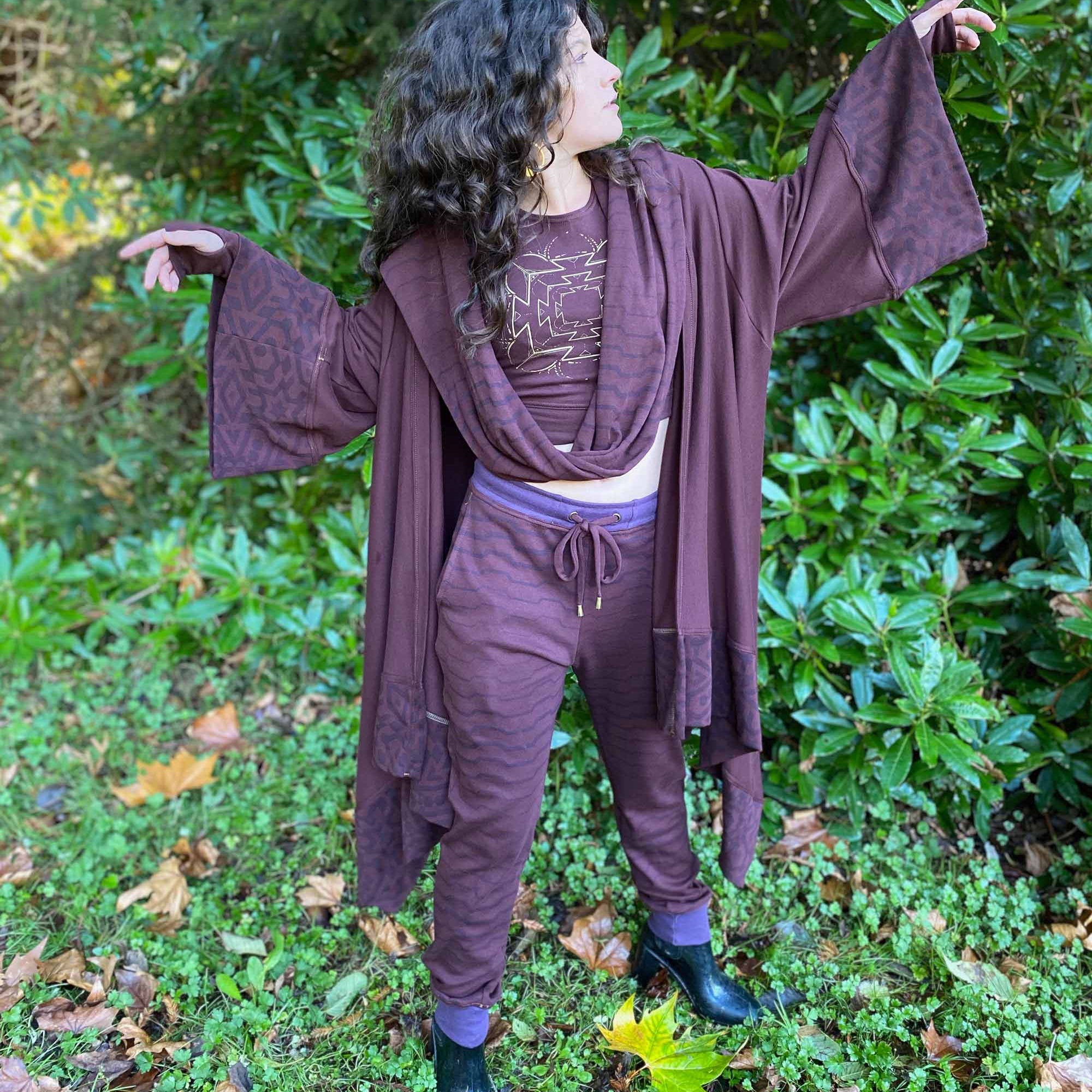 Organic cotton kimono, reddish brown fabric with geo printed accents, front view on female model.