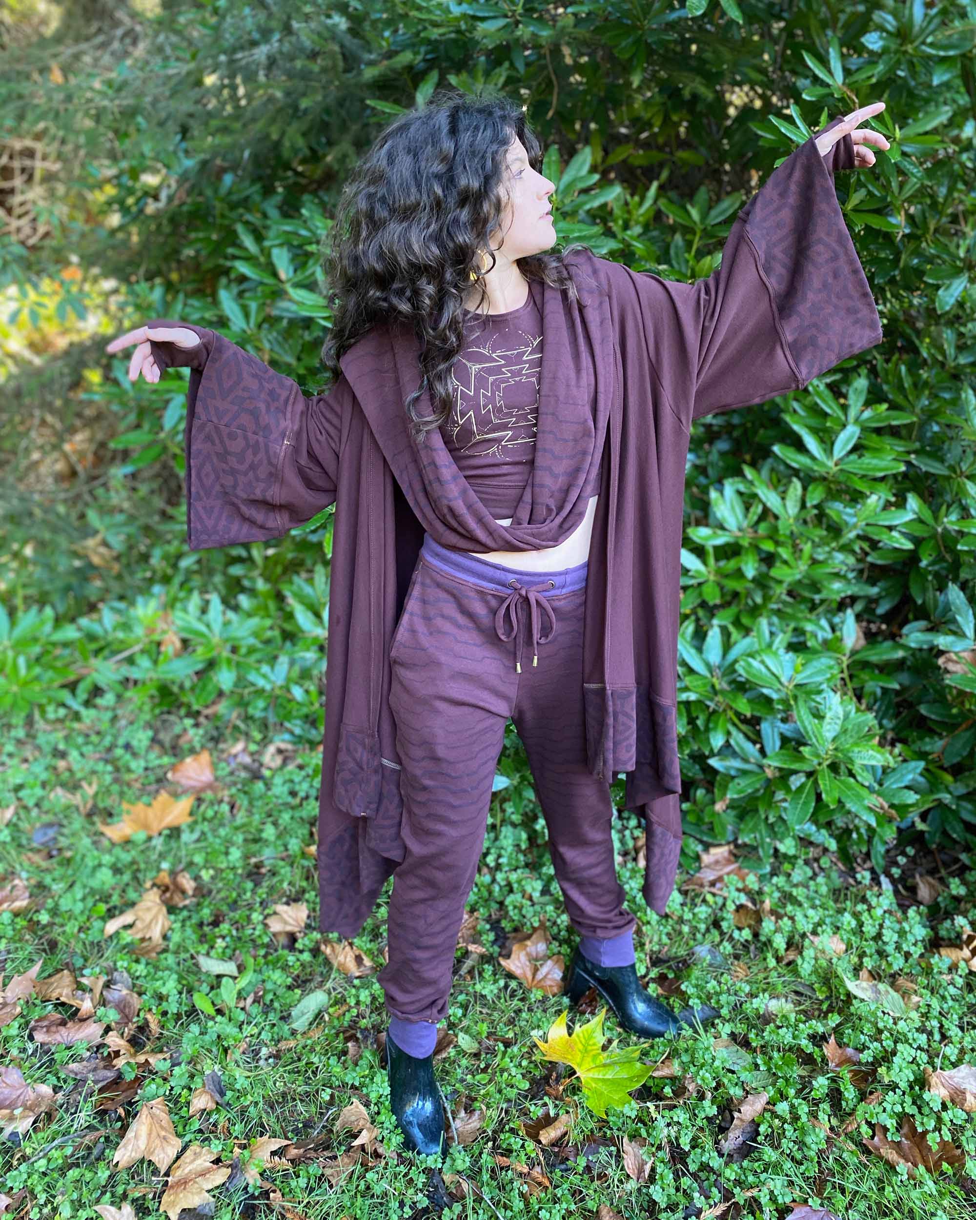 Organic cotton kimono, reddish brown fabric with geo printed accents, front view on female model.