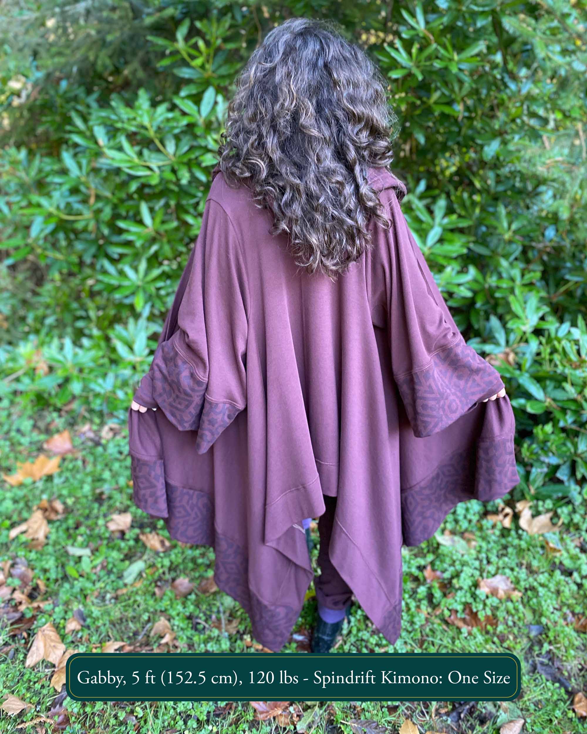Organic cotton kimono, reddish brown with geometric fabric accents, back view on female model.