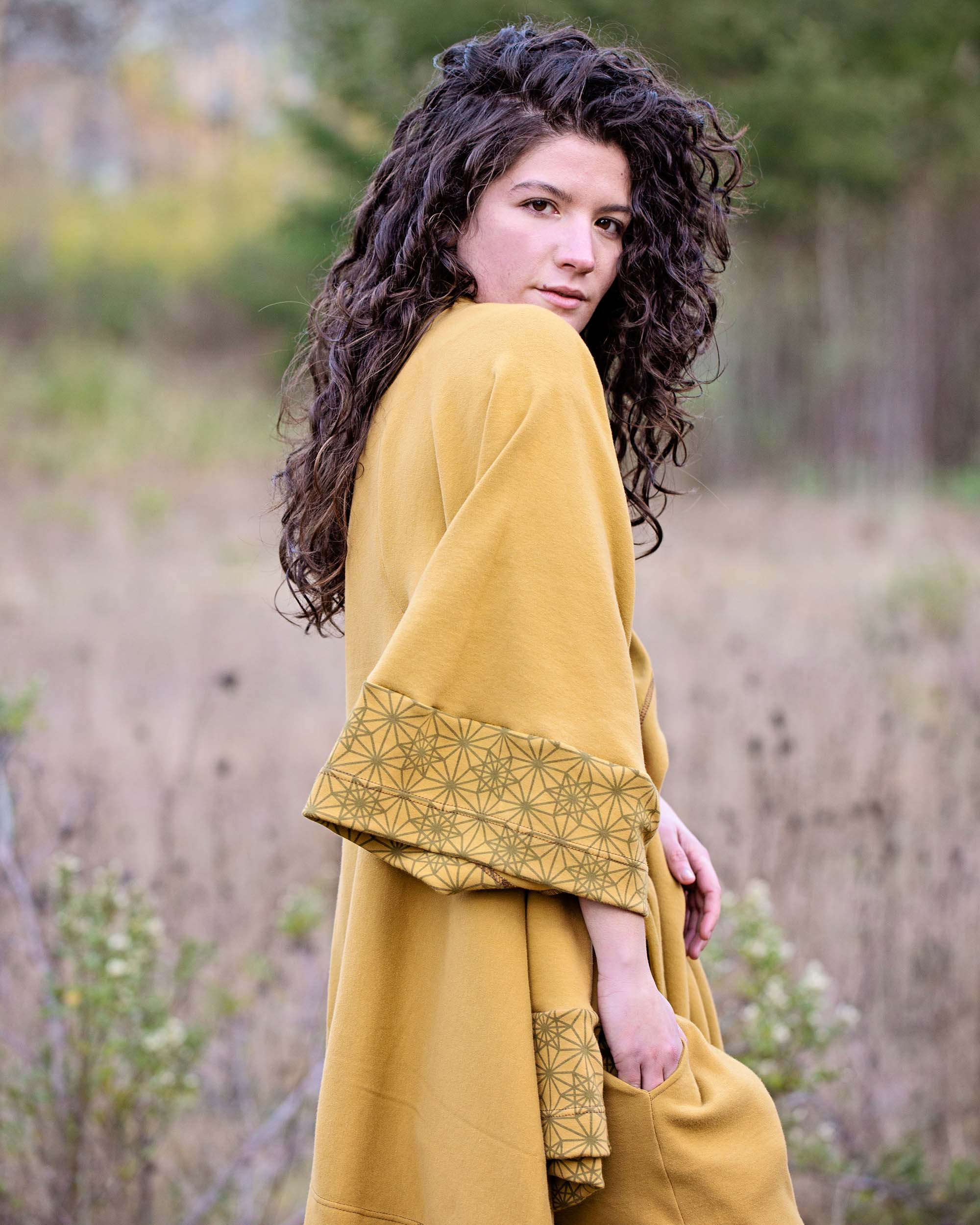 Organic cotton kimono, yellow fabric with geometric print accents, right side detail view.