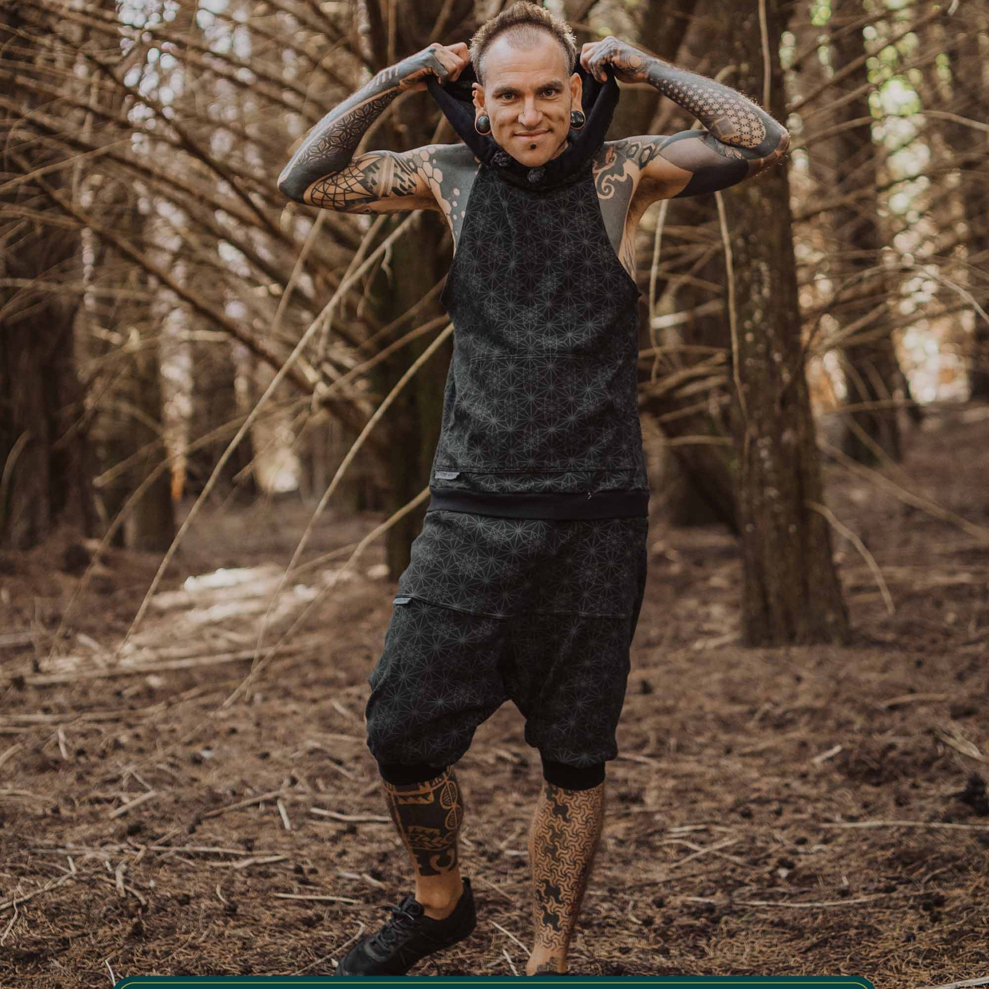Organic cotton matching hooded tank top and shorts, black with geometric fabric, full body view on model.