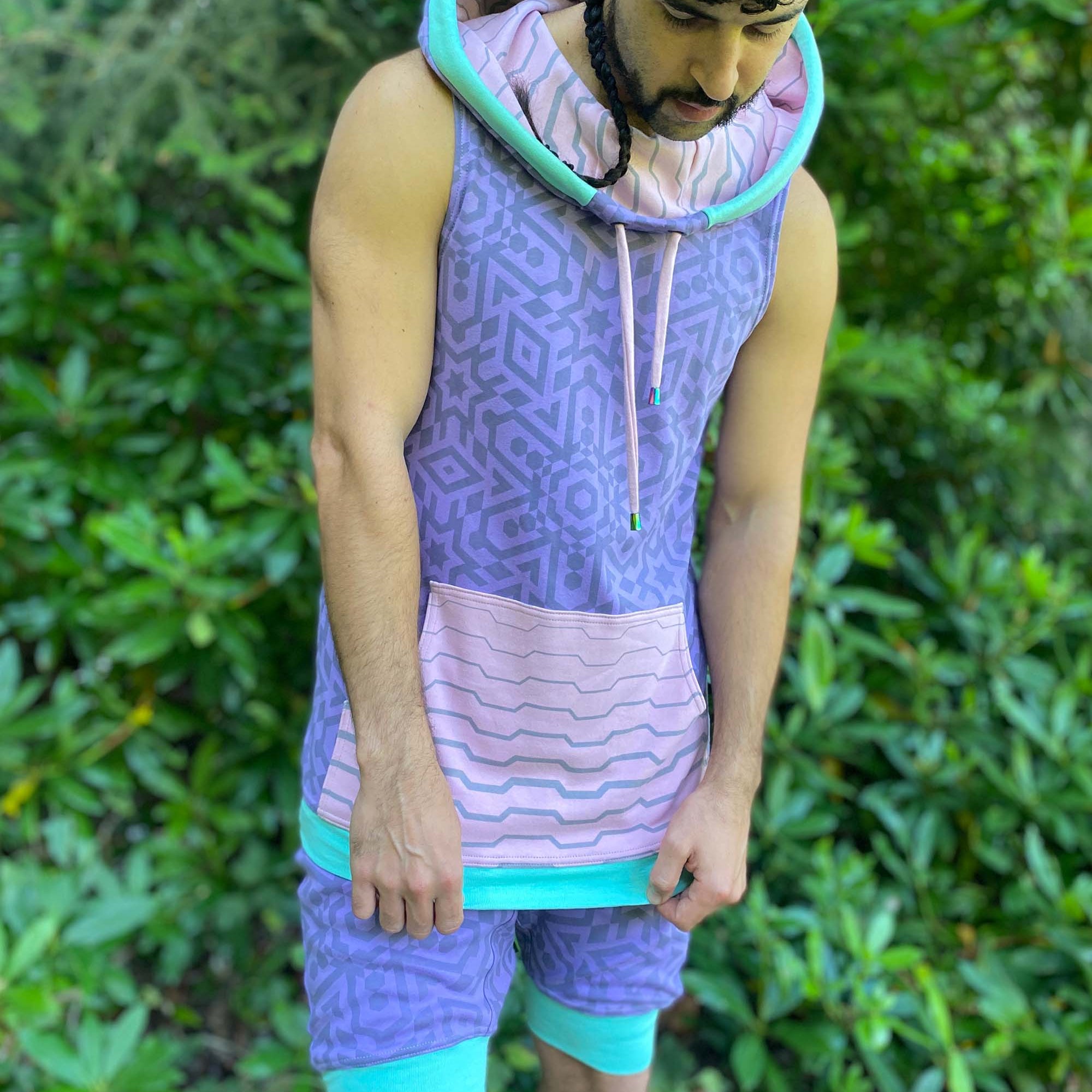 Hooded tank top and drop crotch shorts, lavender fabric with geometric print, front view on model.