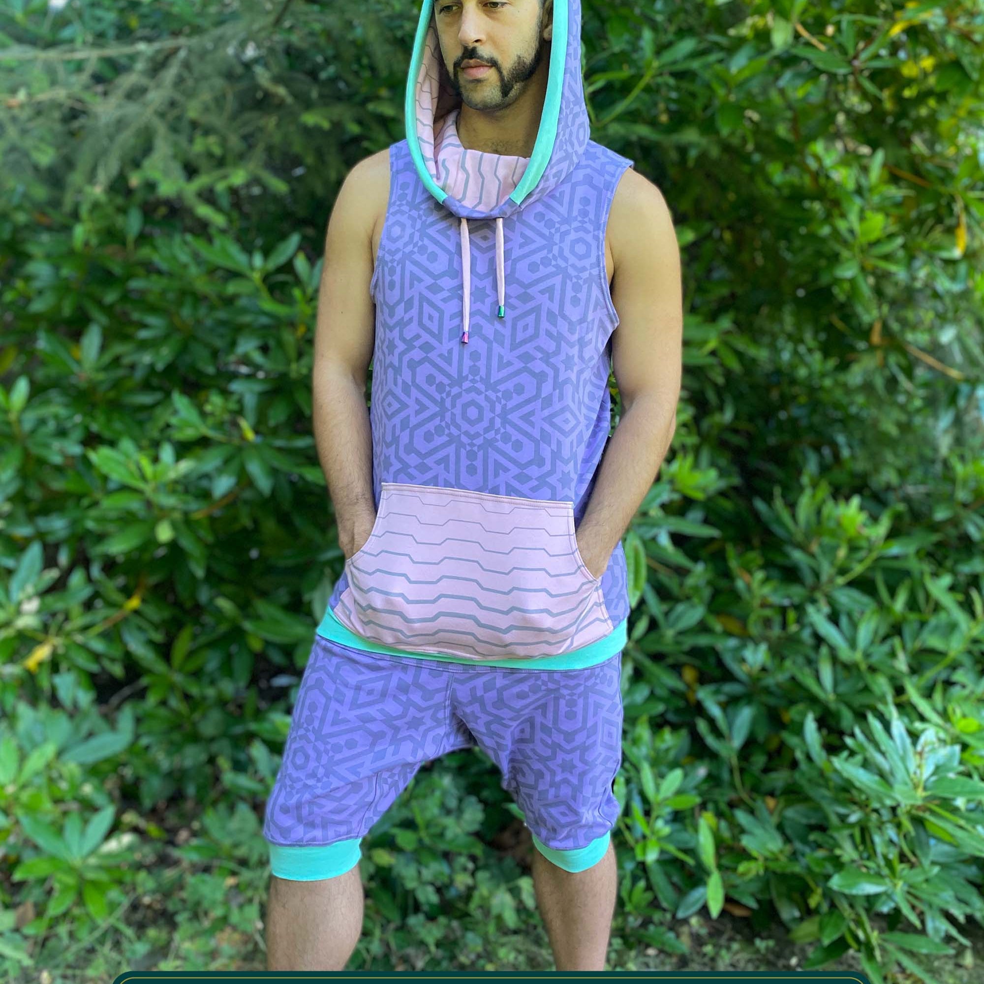 Organic cotton hooded tank top and shorts, lavender fabric with geometric print, full body view on model.