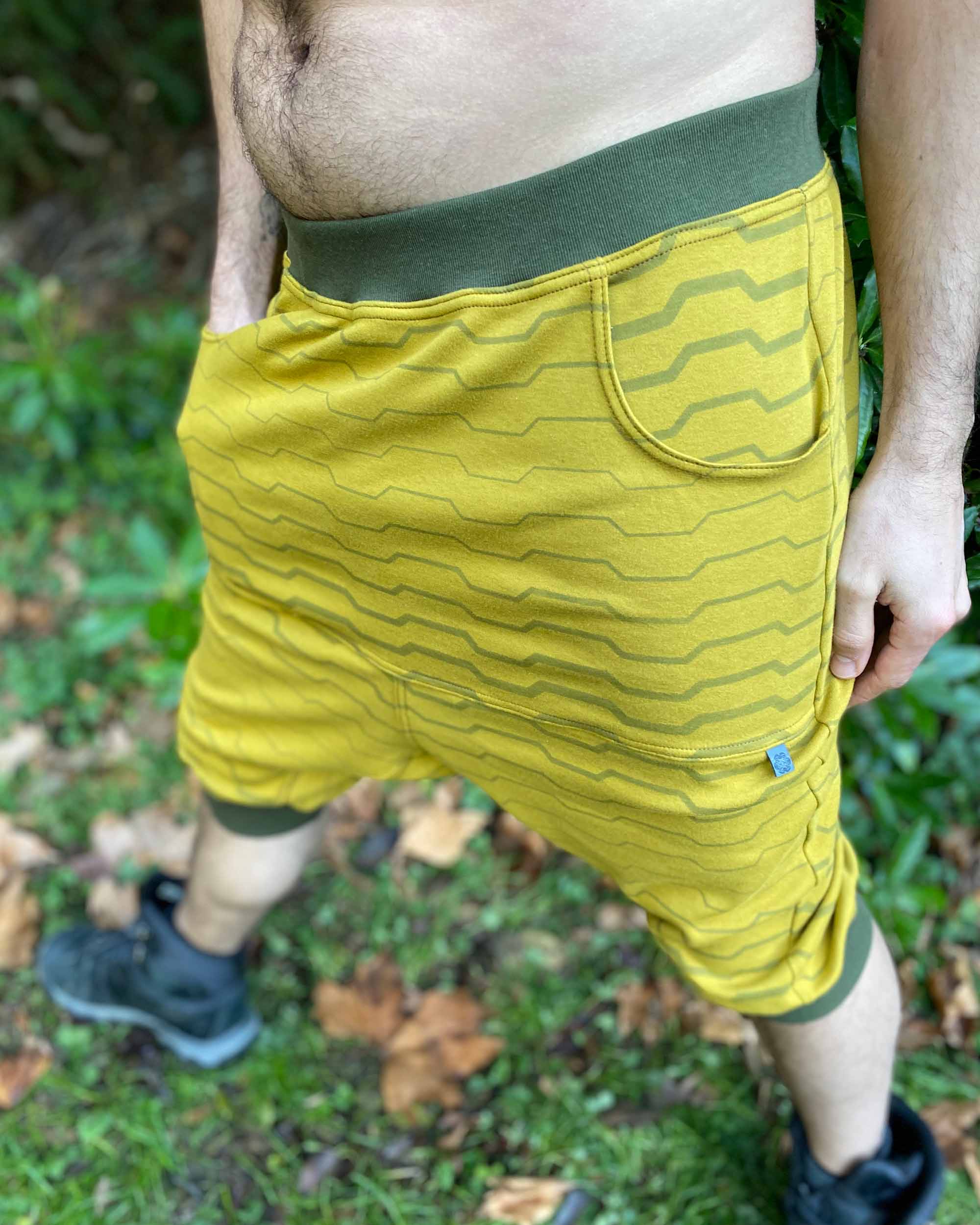 Organic cotton drop crotch shorts, yellow fabric with stripe print, detail view of fabric.