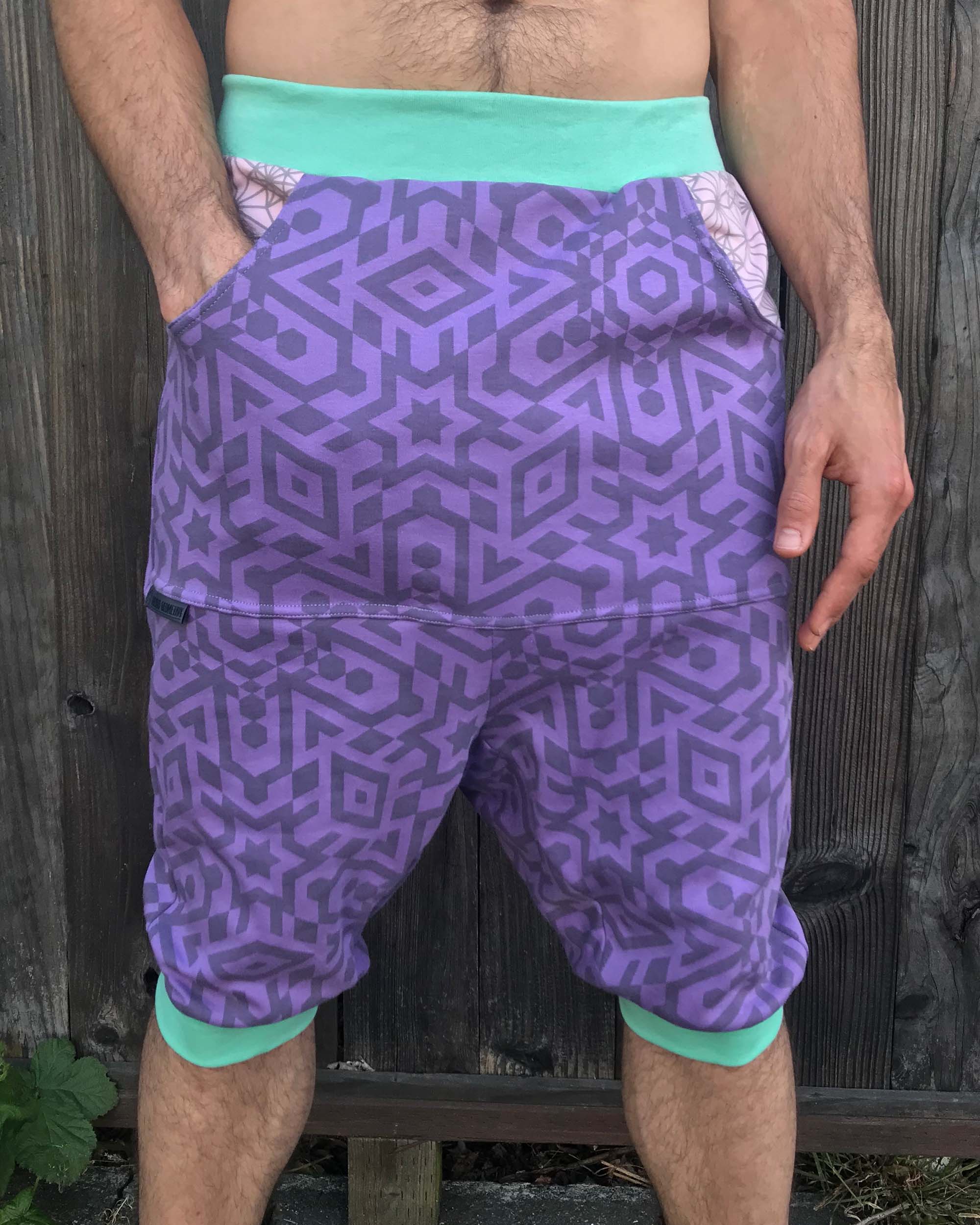 Organic cotton drop crotch shorts, lavender fabric with geometric print, front  view on model.