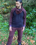 Organic cotton long sleeve crew, black with brown sacred geometry accent fabric, front view on male model.
