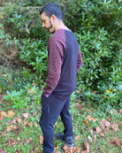 Organic cotton long sleeve shirt, black with brown geometric accent fabric, left side view on male model.