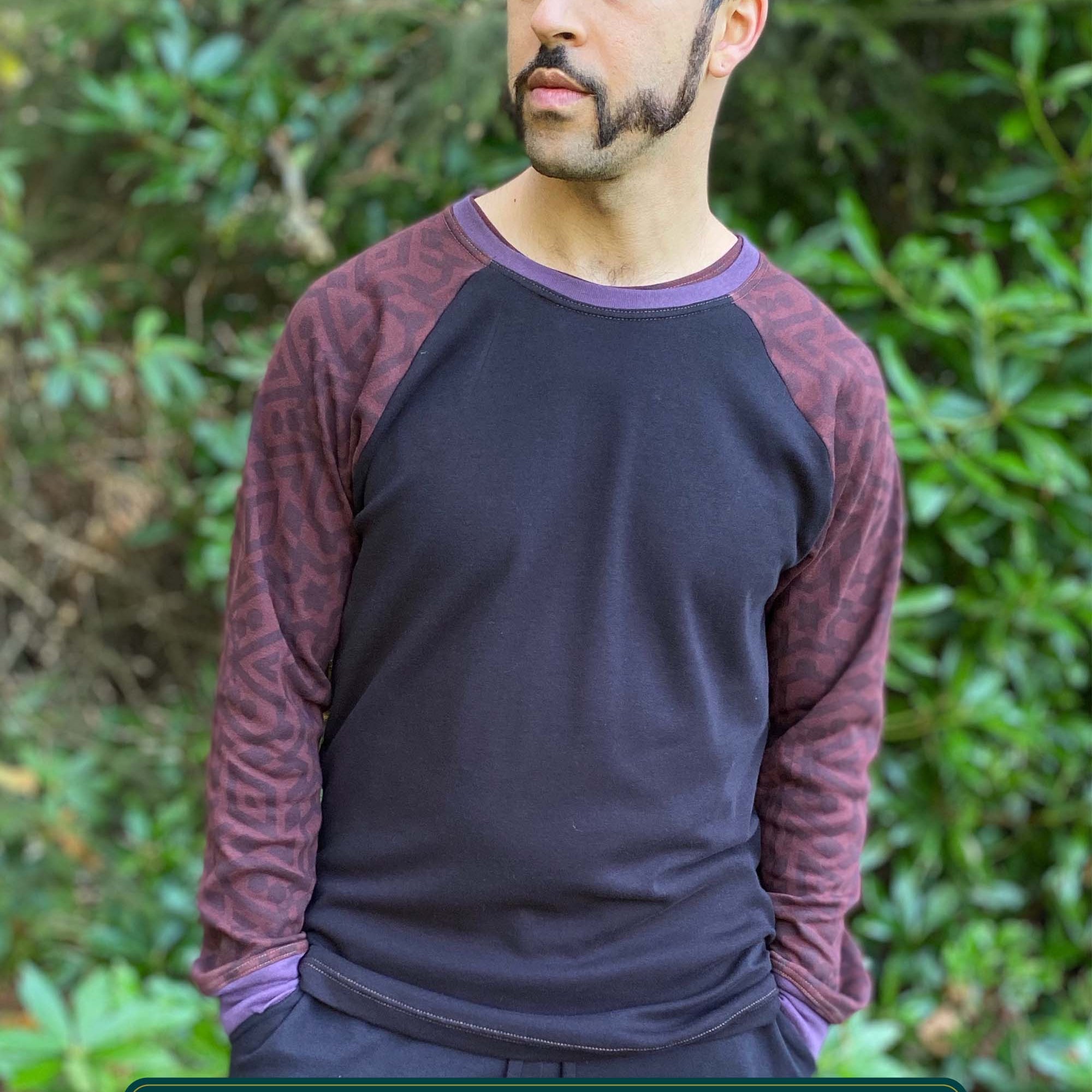 Organic cotton long sleeve shirt, black with brown geometric accent fabric, front view on male model.