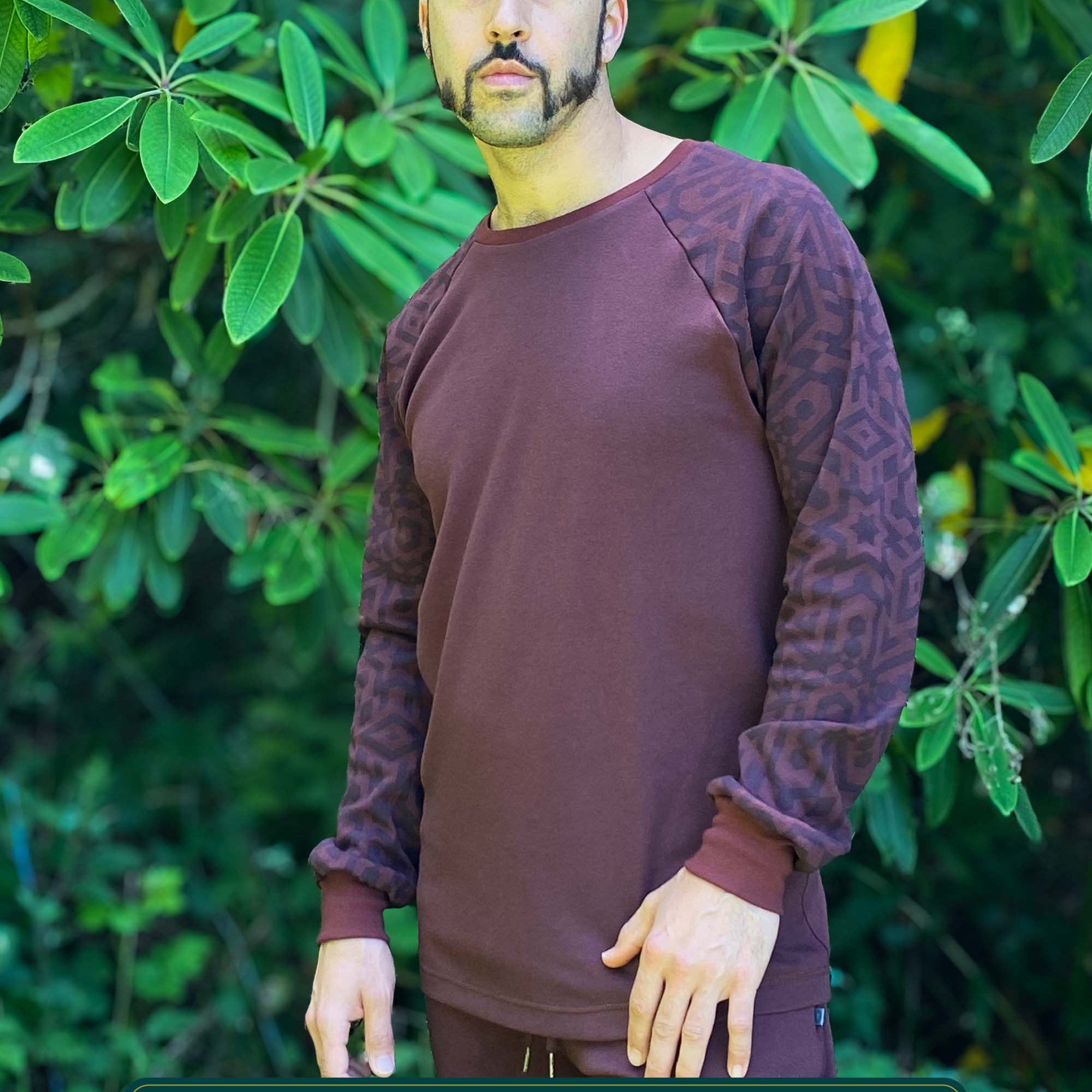 Organic cotton long sleeve shirt, brown with geometric sleeves, front view on model.