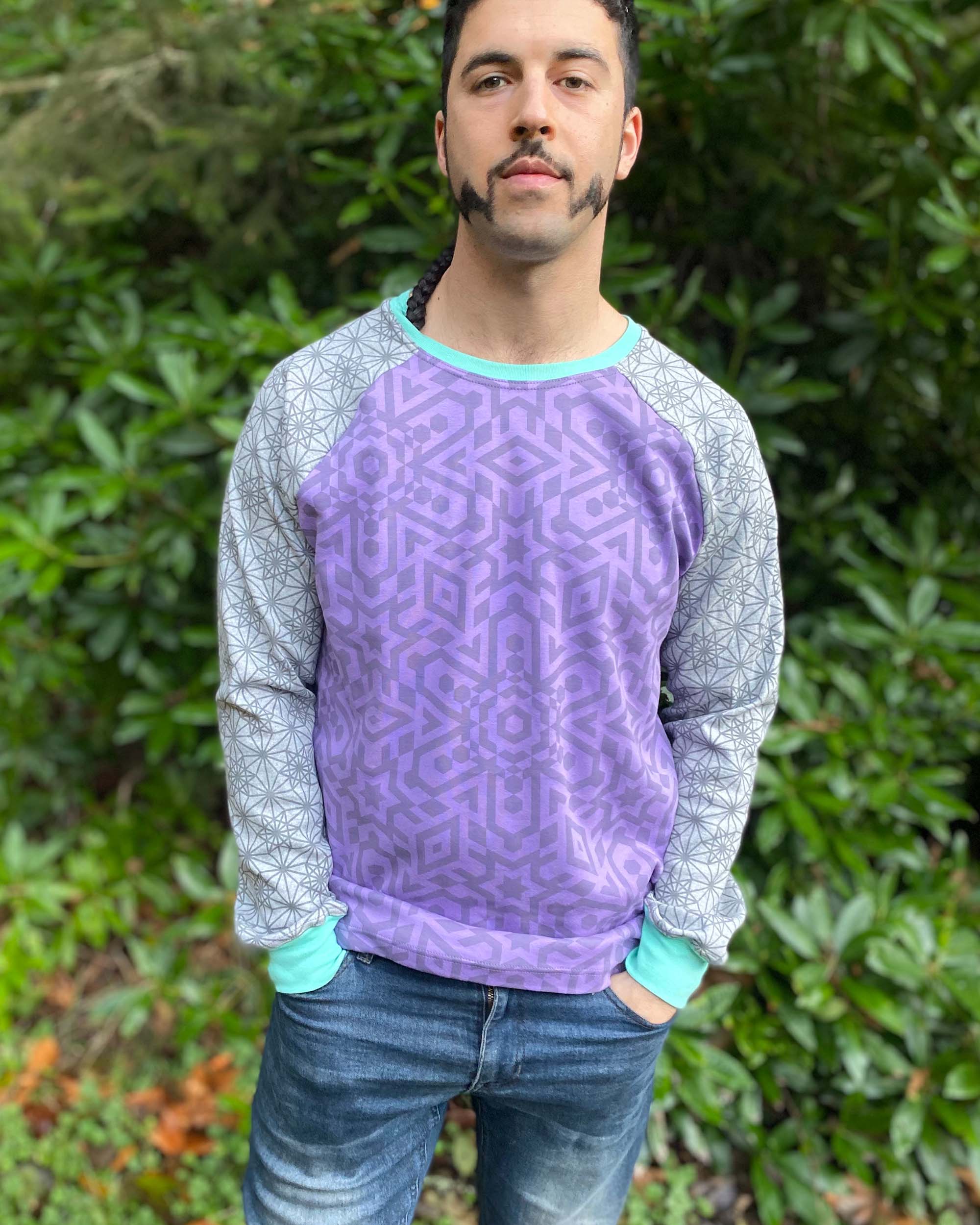 Organic cotton long sleeve shirt, lavender torso with grey geometric sleeves, front view on male model.