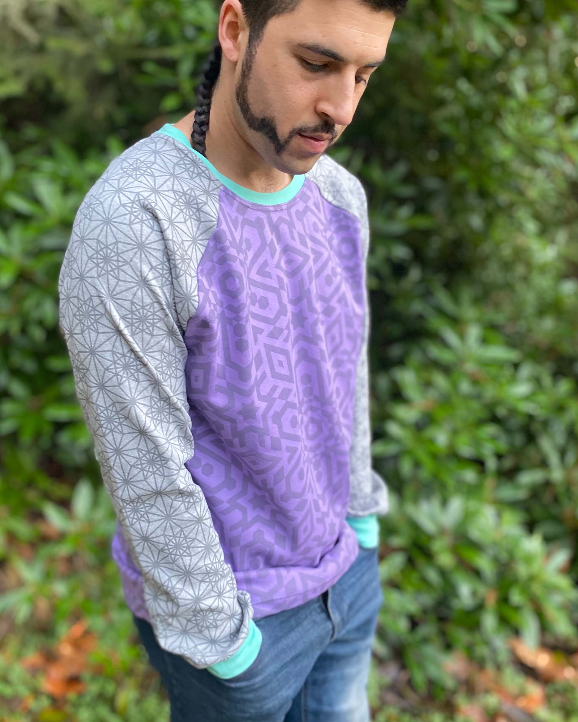 Organic cotton long sleeve shirt, lavender torso with grey geometric sleeves, right side view on model.