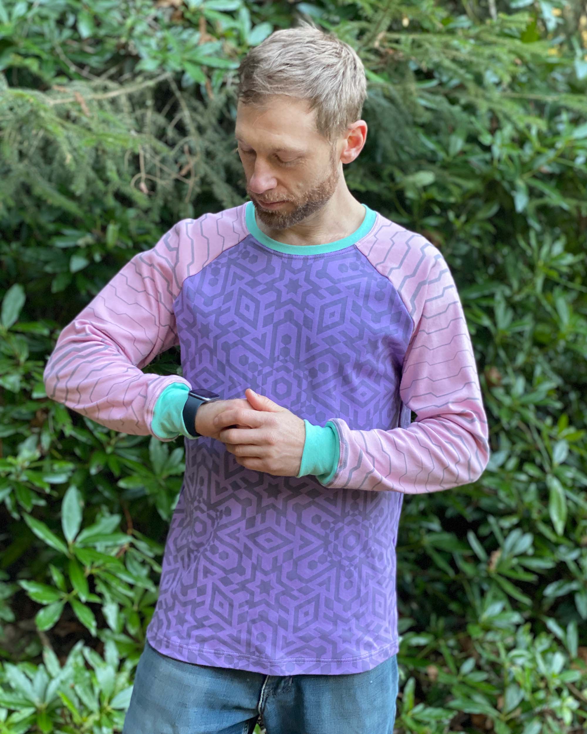 Organic cotton long sleeve crew neck, lavender with pink geometric sleeves, front view on model.