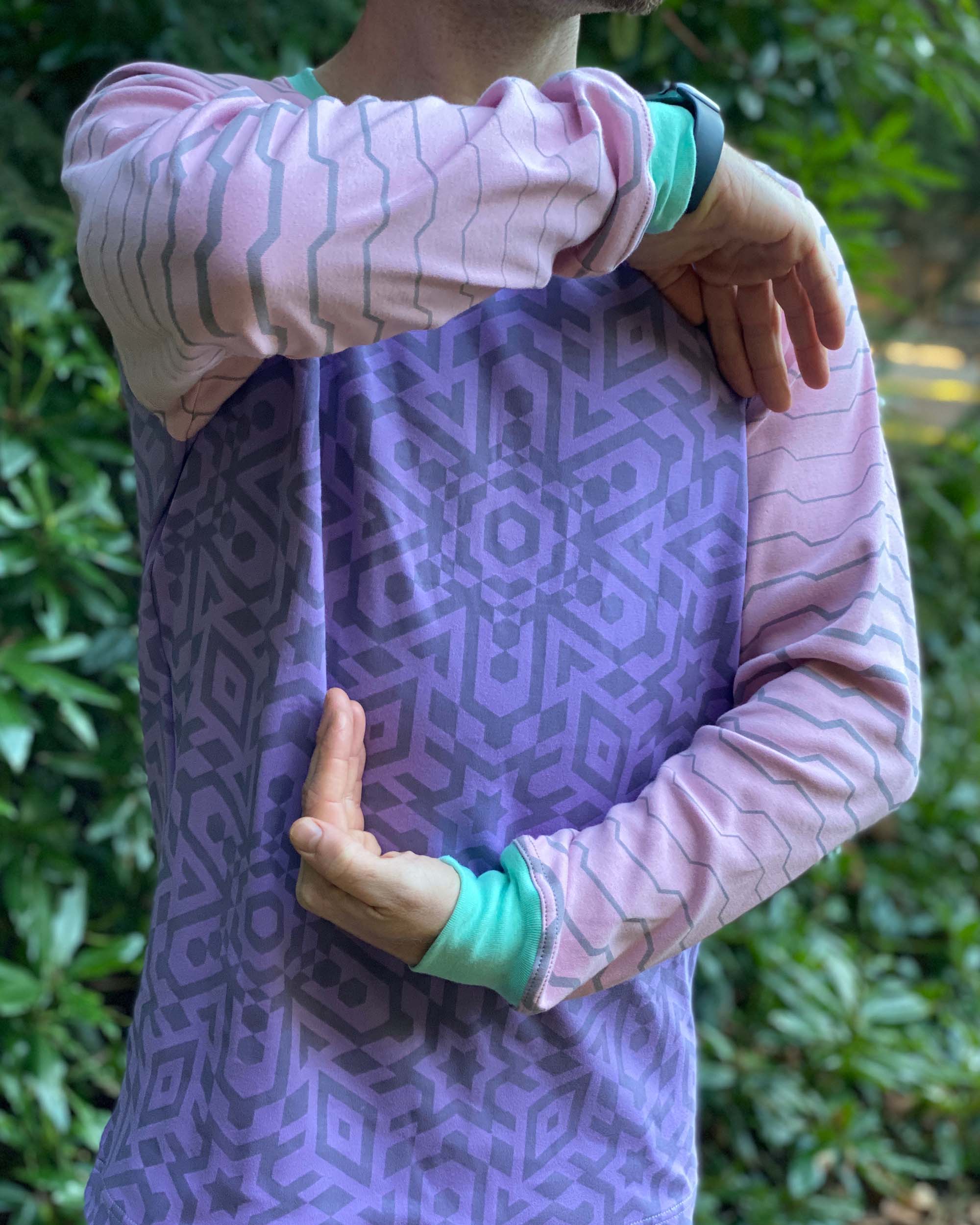 Organic cotton long sleeve shirt, lavender with pink geometric striped sleeves, detail view of fabric.