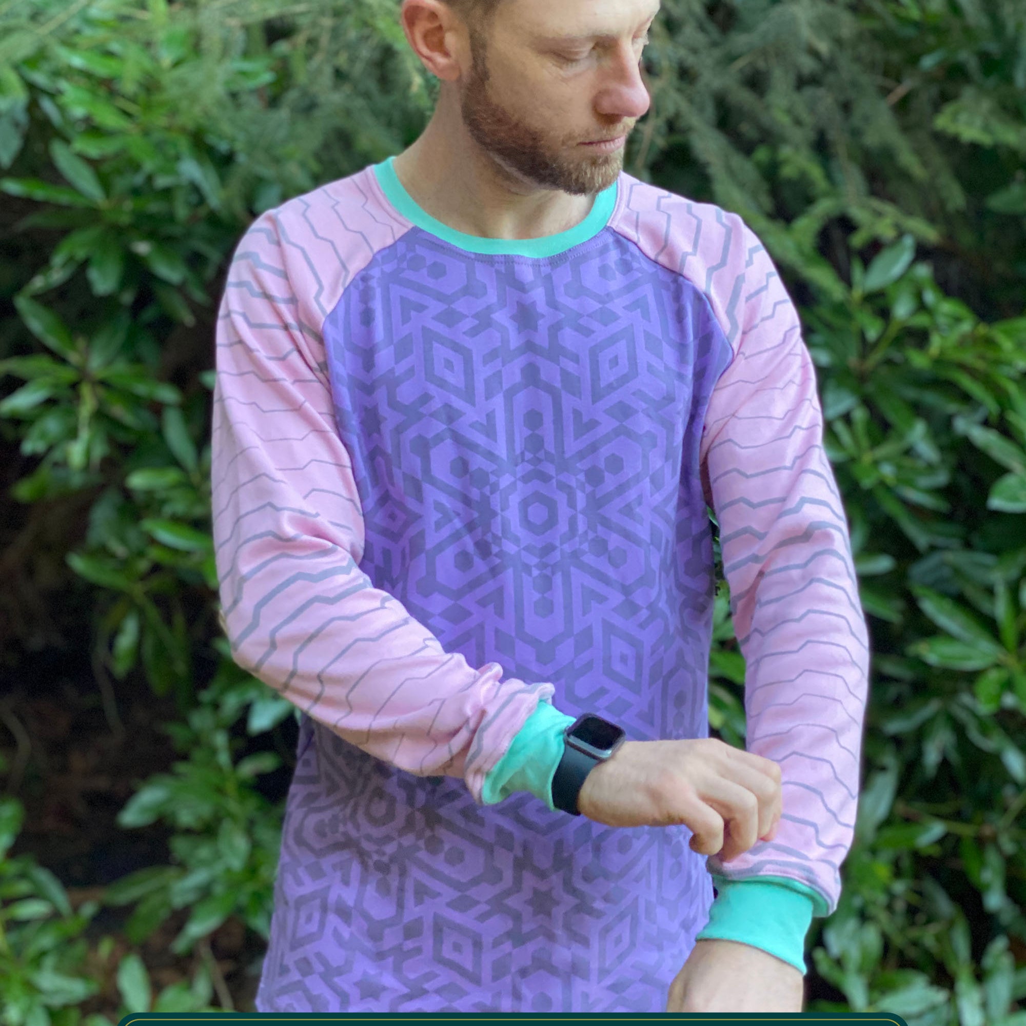Organic cotton long sleeve shirt, lavender with pink geometric striped sleeves, front view on model.