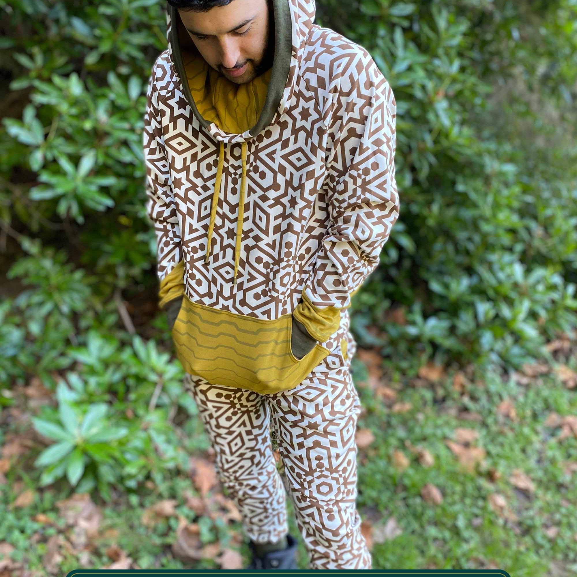 Men's matching two piece sweatsuit, geometric print, organic fabric, front view, worn on model.