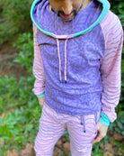 Men's matching two piece sweatsuit, pink and purple fabric, geometric print, detail view of fabric.