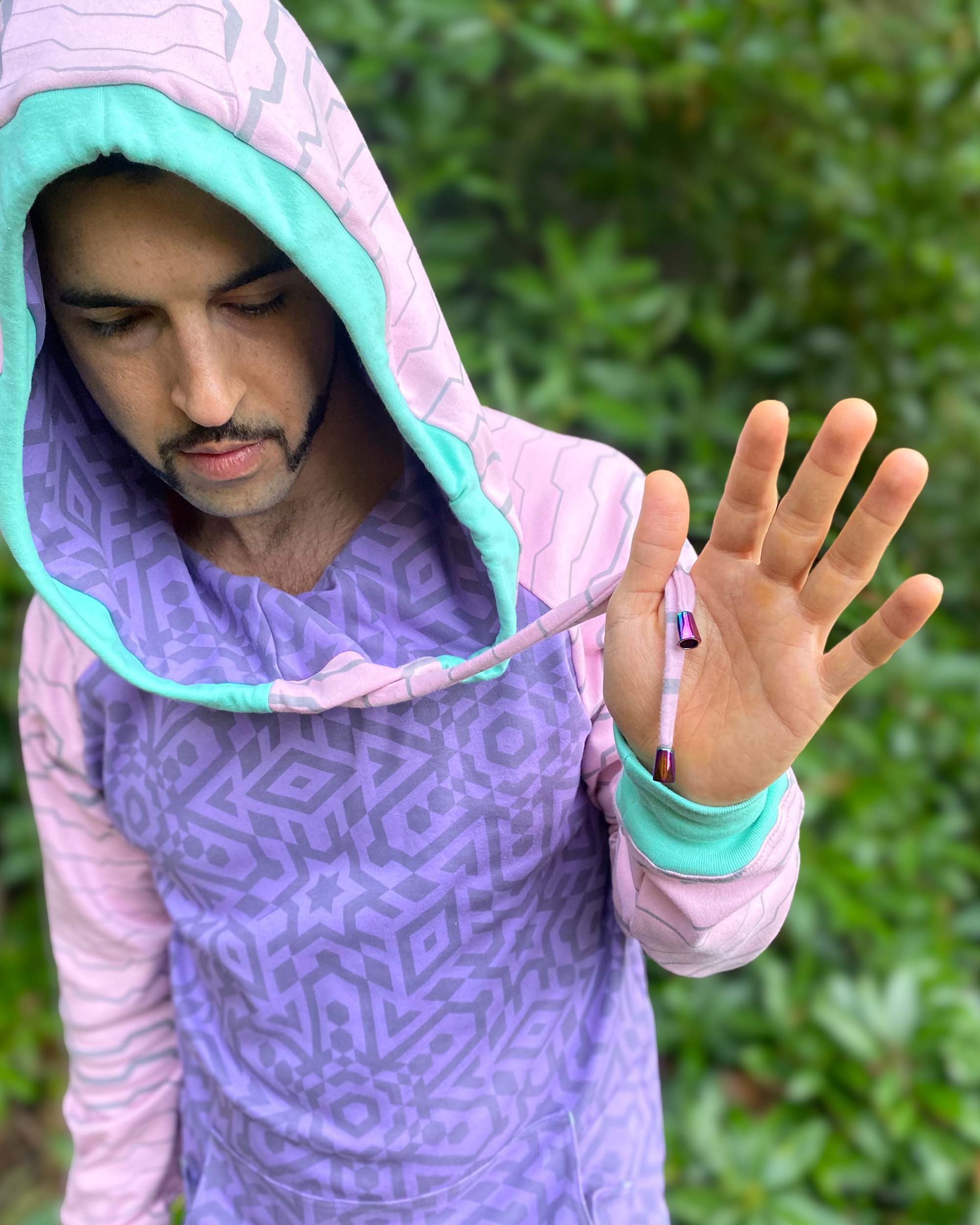 Organic cotton hoodie, pink and purple fabric, geometric print, detail view of drawcords.