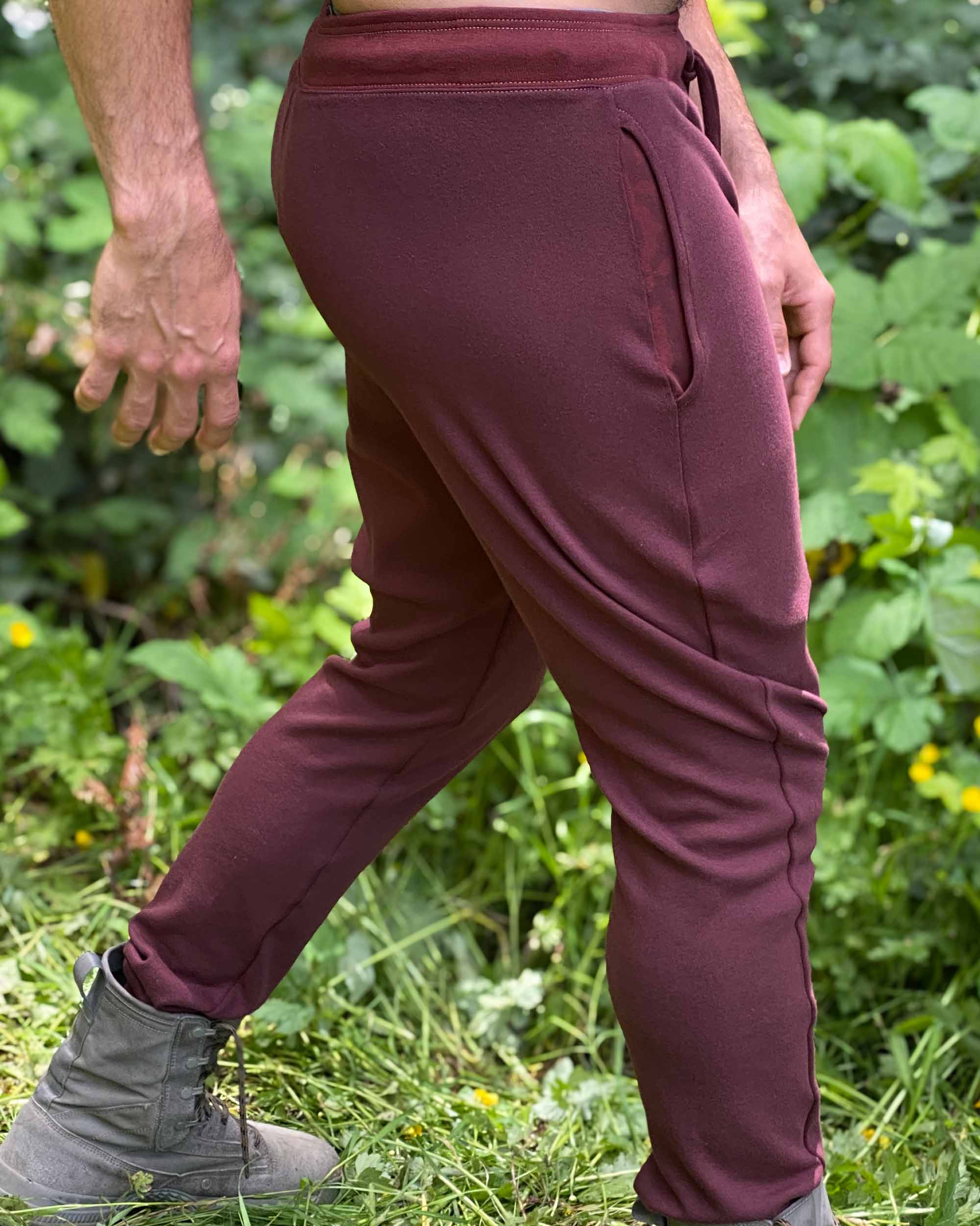 Organic cotton unisex joggers, reddish brown fabric, detail view of pocket.