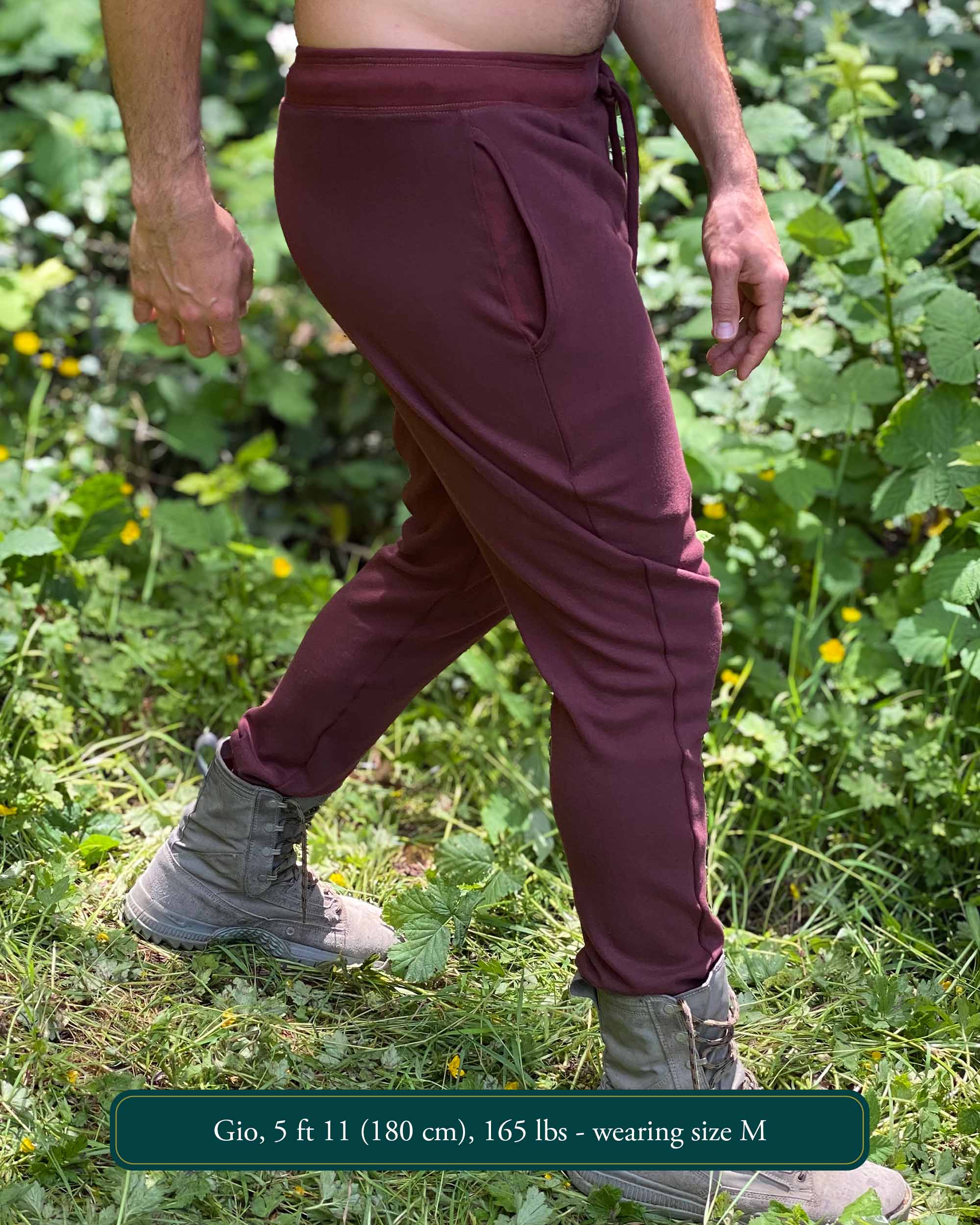 Organic cotton unisex joggers, reddish brown fabric, right side view on male model.