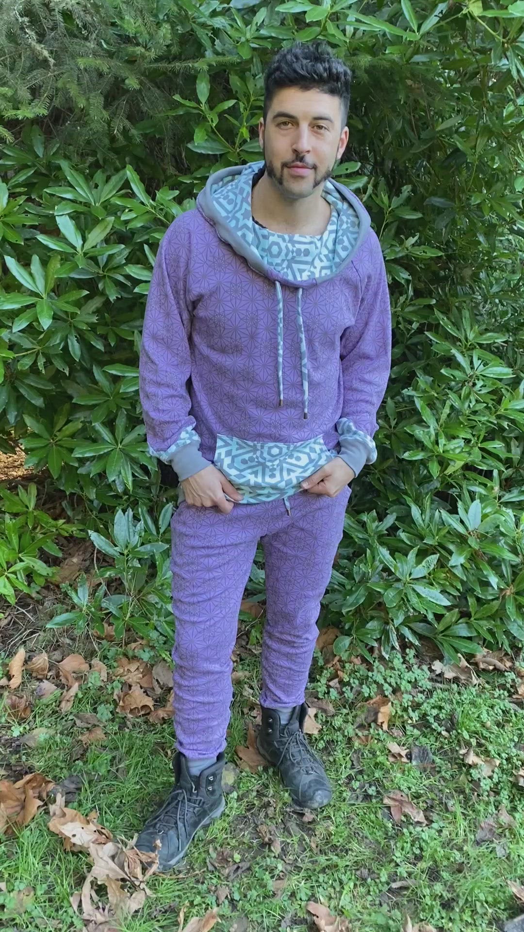 Men's matching two piece sweatsuit, lavender geometric printed organic cotton fabric, worn on male model.