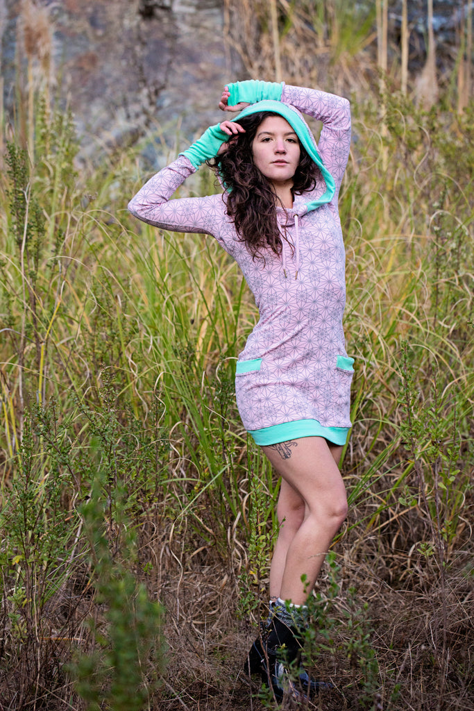 Pink hoodie dress with sacred geometry design. Deep drawstring hood. Festival wear made in the USA from organic cotton.