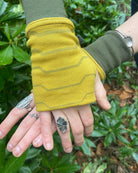 Organic cotton fingerless gloves in yellow fabric with geometric print, top right hand view.
