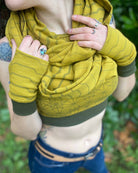 Organic cotton fingerless gloves, crop top and scarf in matching yellow fabric with geometric print, front view.