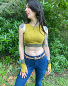 Organic cotton fingerless gloves and crop top in matching yellow fabric with geometric print, worn by female model.