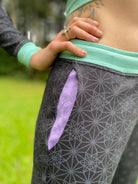 Unisex black joggers with Purple drawcord and seafoam color accents. Sacred Geometry Screen Printed Fabric made in the USA with organic cotton.