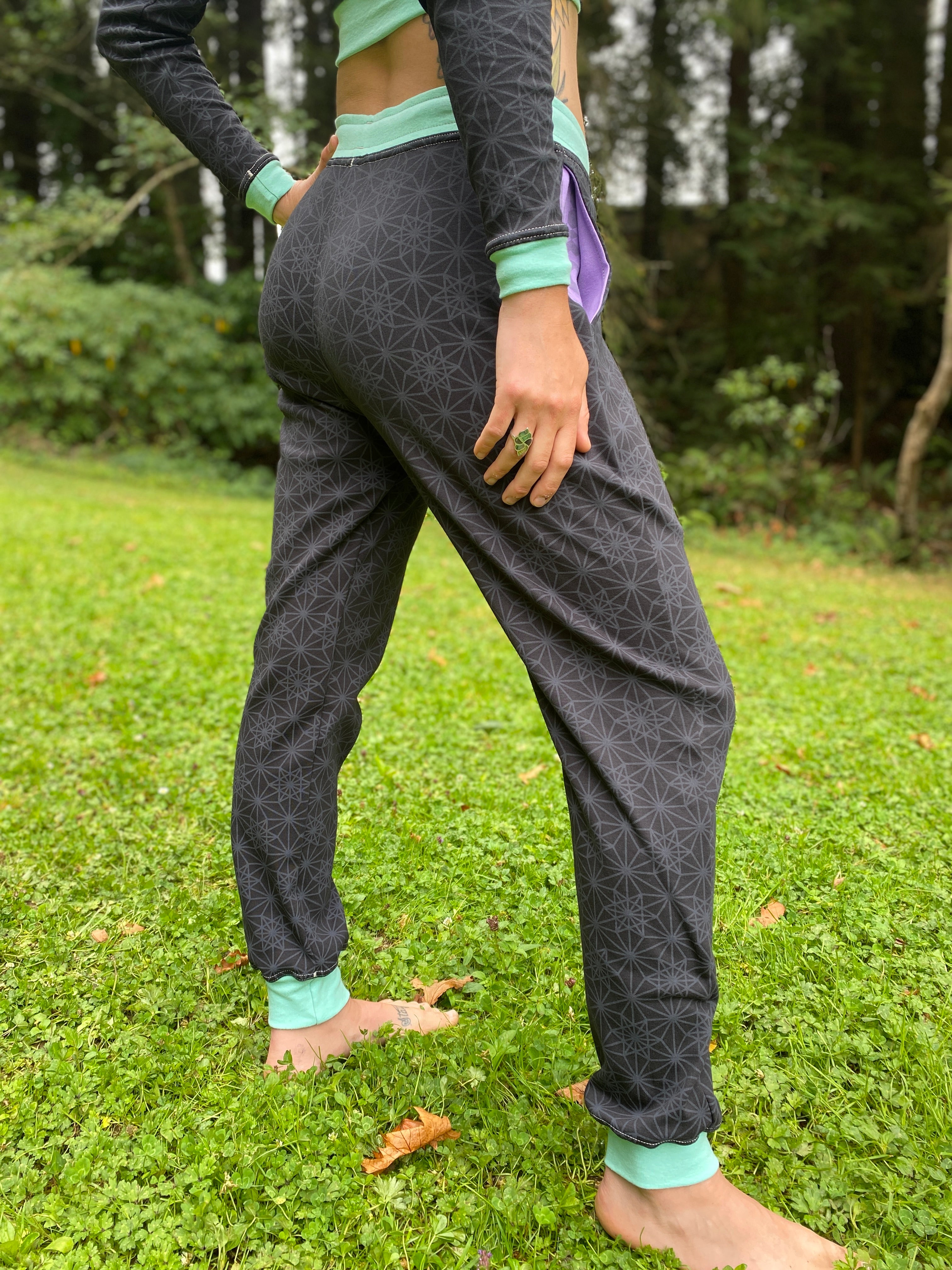 Unisex black joggers with Purple drawcord and seafoam color accents. Sacred Geometry Screen Printed Fabric made in the USA with organic cotton.