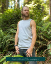 Organic cotton mens tank top, grey fabric, left side view, on model in nature.