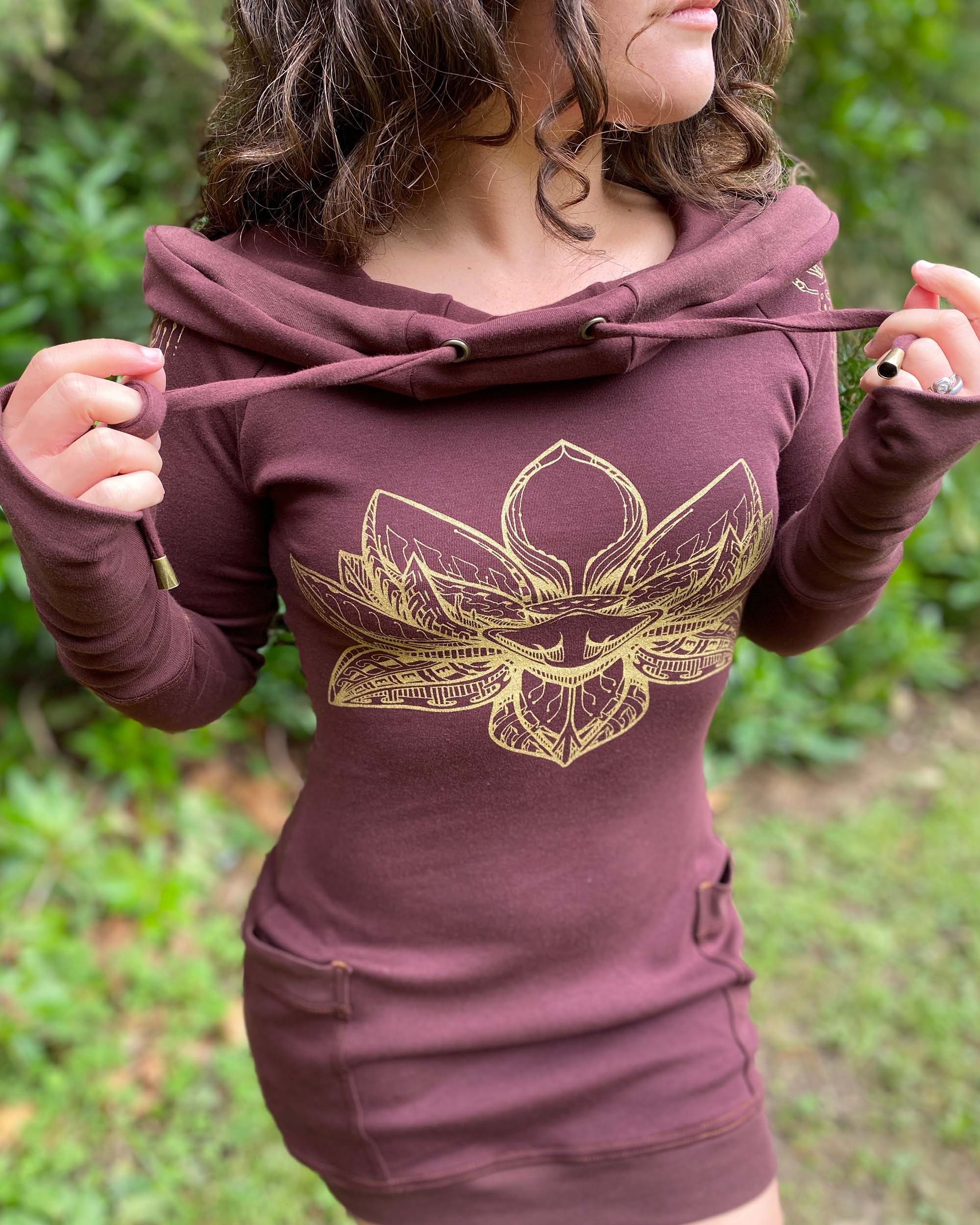 Organic cotton long sleeve tunic dress, brown fabric with front gold lotus print, detail view of screen print.