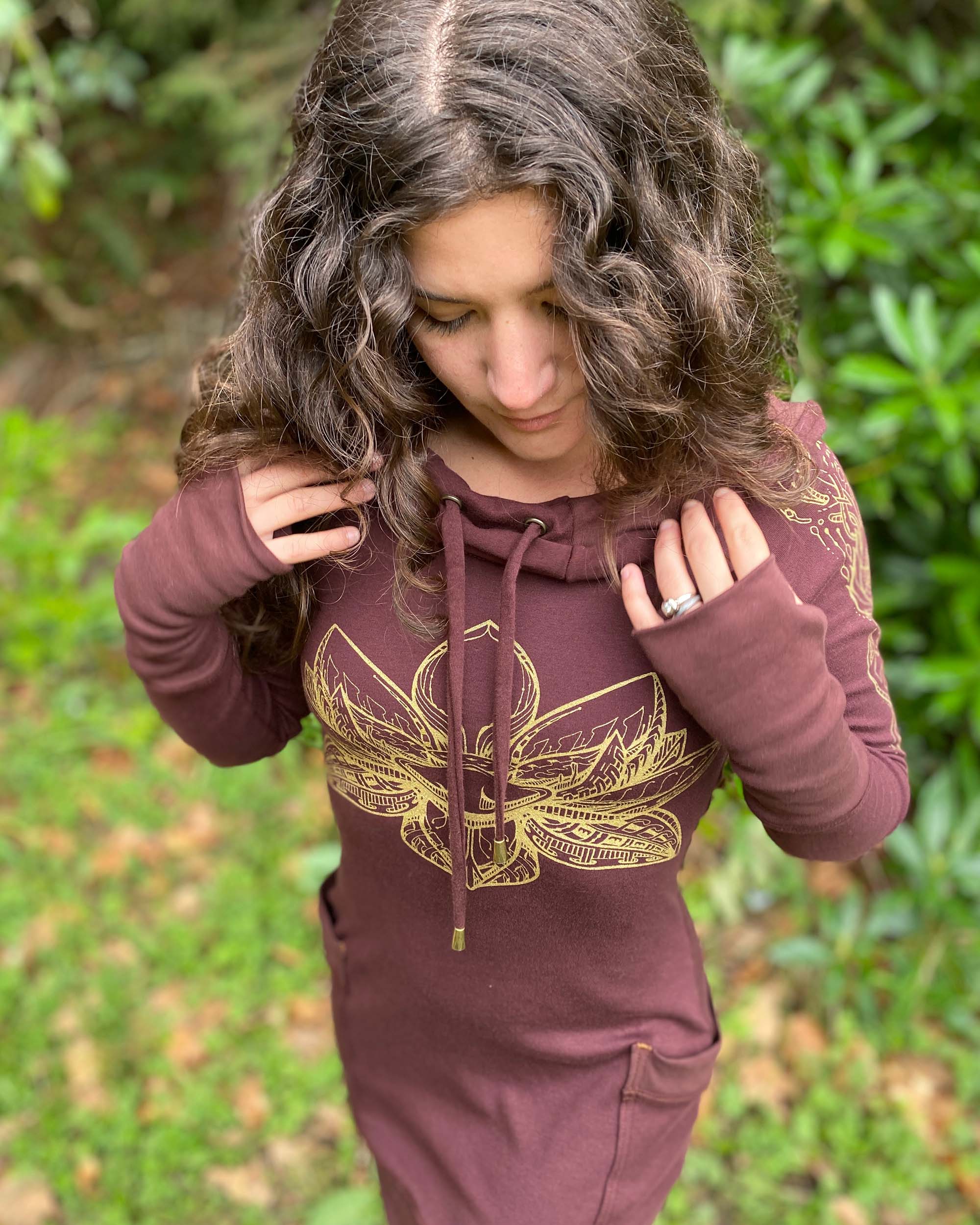Organic cotton long sleeve tunic dress, brown fabric with front gold lotus print, detail view of drawcords.