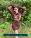 Organic cotton long sleeve tunic dress, brown with front gold lotus print, front view on female model.