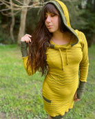 Organic cotton long sleeve tunic dress, yellow with green accent fabric, full length front view on female model.