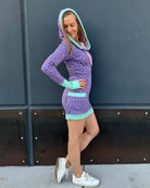 Organic cotton fitted tunic dress, lavender with geometric print with, right side view on female model.