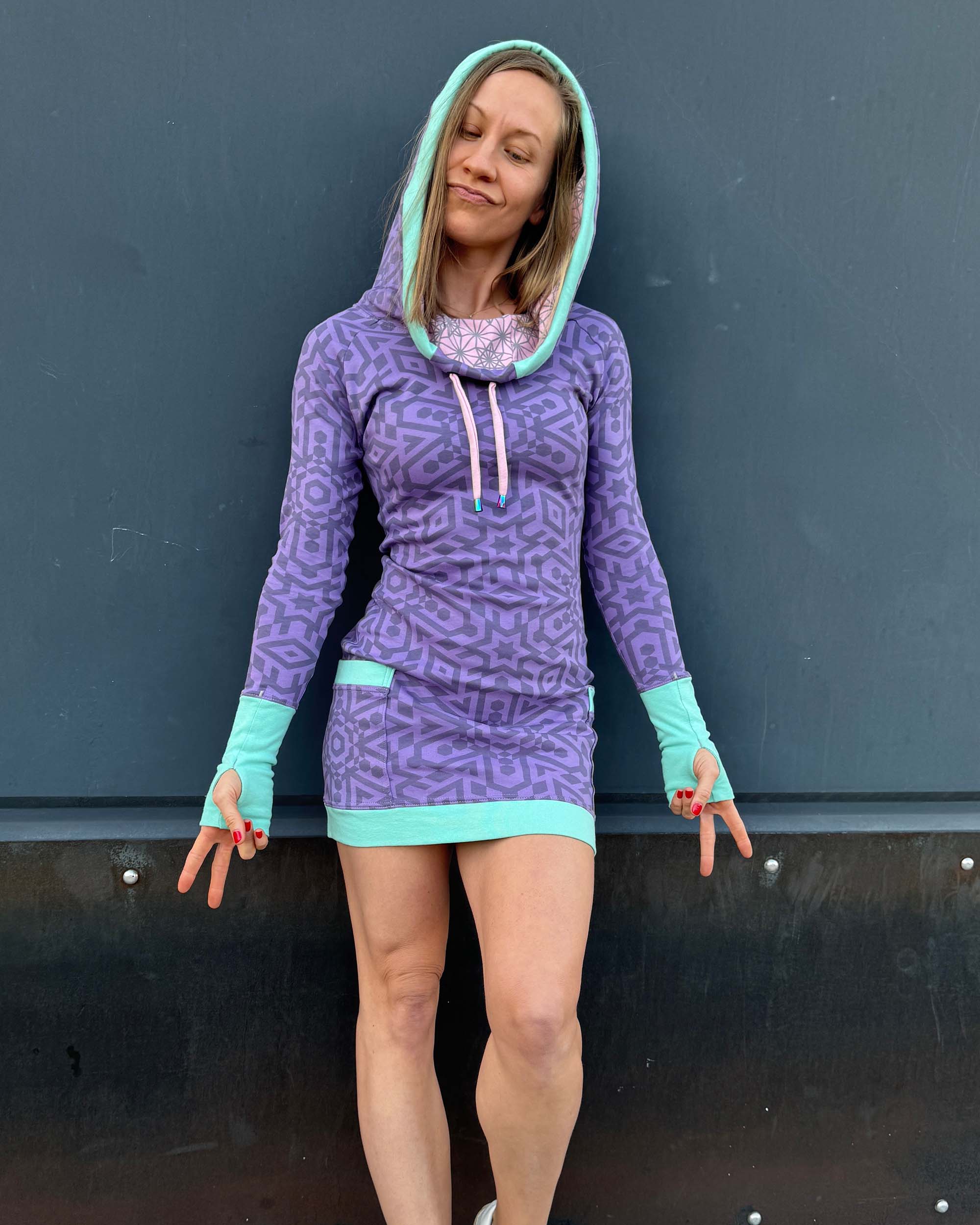 Organic cotton fitted tunic dress, lavender with geo printed fabric, front view on female model.