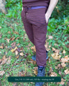 Organic cotton fleece joggers, reddish brown fabric with geometric all over print, front view on male model.