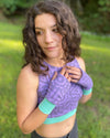 Organic cotton crop top and hand warmers in lavender fabric and geometric print, right side view on female model.