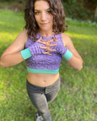 Organic cotton fingerless gloves in lavender fabric and geometric print, front view of female model.