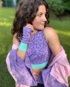 Organic cotton fingerless gloves and crop top in lavender fabric and geometric print, right side view of female model.