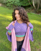 Organic cotton fingerless gloves and crop top in lavender fabric and geometric print, worn by female model in pink kimono.