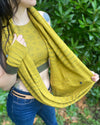 Organic cotton infinity scarf, yellow fabric with geometric stripes, detail view of fabric.