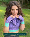 Female model wearing matching set of crop top, infinity scarf and fingerless gloves, lavender organic cotton fabric with geometric print, front view.
