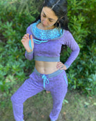 Matching two piece set, joggers and crop hoodie, lavender with geo printed fabric, worn on female model.