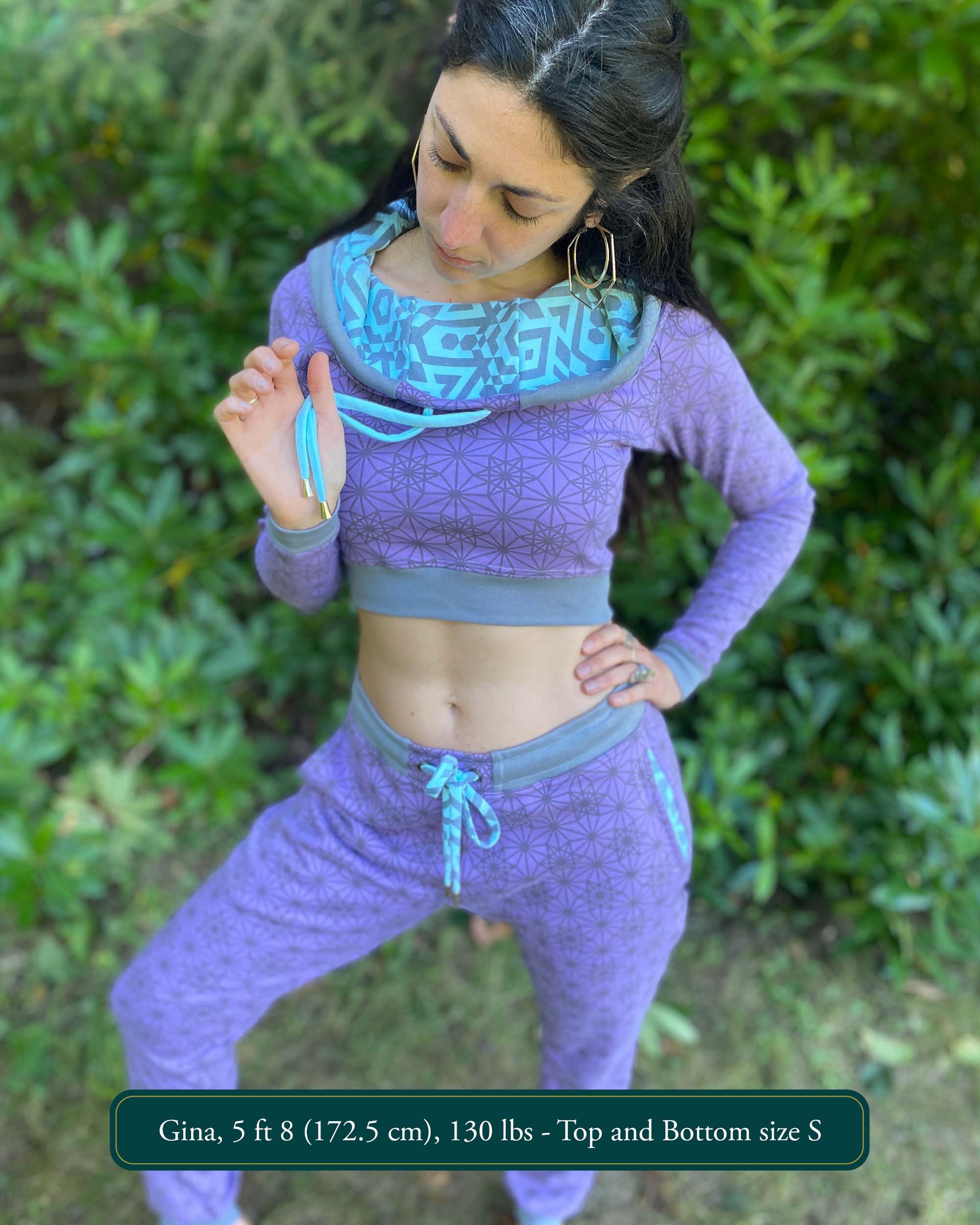 Matching two piece set, joggers and crop hoodie, lavender with geometric printed fabric, worn on female model.
